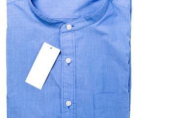 Folded shirt with white tag isolated