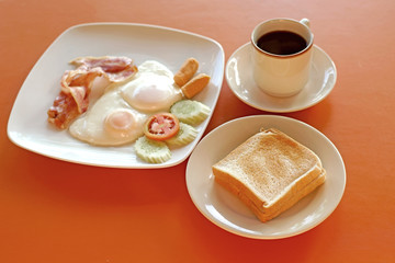 breakfast meal with sausage bacon egg  toast and coffee