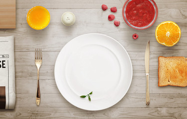 Empty plate on the table waiting for serving. Top view of tablecloth, newspaper,cutting board, coffee.