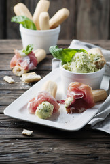 Italian grissini with cream cheese and prosciutto