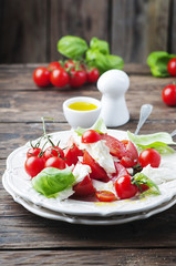 Italian salad caprese with tomato and mozzarella