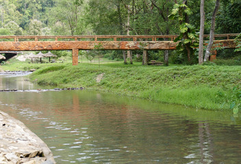 Fototapeta na wymiar the bridge across creek stream