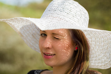 cheerful fashionable woman with hat