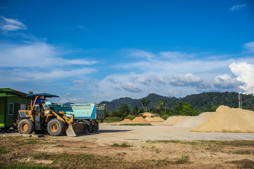 Obraz premium sand ,land and vehicle for construction