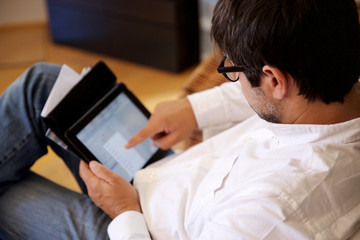 adult man typing on digital devices