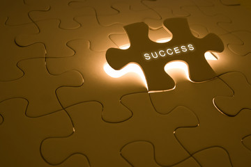 success concept with puzzle  and light