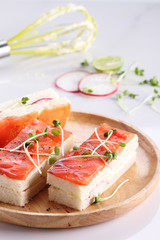 smoked salmon and radish finger sandwiches.