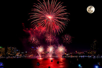 Fireworks celebration with super moon in the city