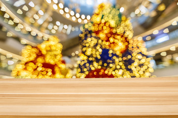 fuzzy abstract christmas tree Light spot background and Wood tabletop
