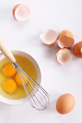raw eggs in bowl.
