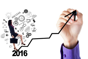 Businesswoman climbs stairs with numbers 2016