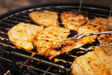 cooking steak with sauce on the grill