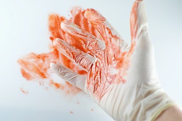 Scalpel and hands in the blood