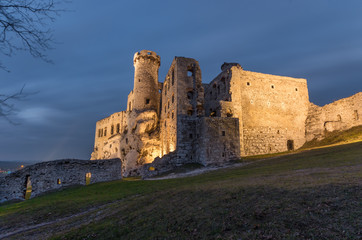 Ruins of medieval castle in Ogrodzieniec, Poland, illuminated in the night
