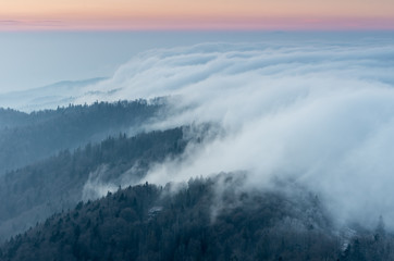 Obraz premium Carpathian mountains. Gorce in the clouds, seen from Luban mountain in Beskidy, Poland