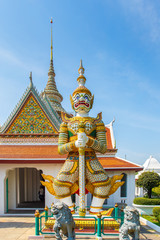 Fototapeta premium Giant in front of buddha temple in Bangkok Yai district of Bangkok, Thailand, on the Thonburi west bank of the Chao Phraya River.