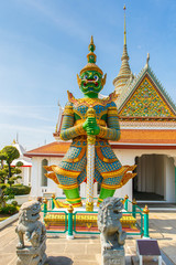 Giant in front of buddha temple in Bangkok Yai district of Bangkok, Thailand, on the Thonburi west bank of the Chao Phraya River.