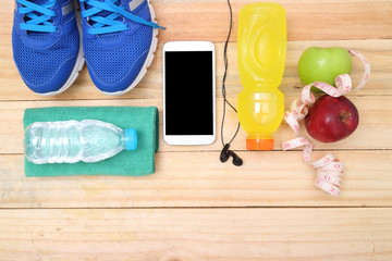 Sport shoes and water with set for sports activities on tiled floor.sports, fitness, concept of weight loss