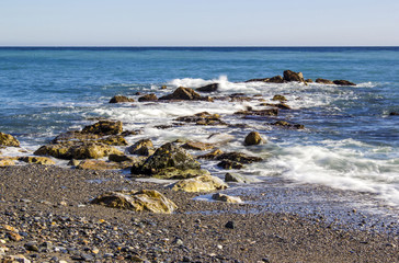 Fototapeta na wymiar Stone beach in Almunecar, Andalusia, Spain