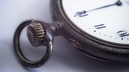 Close-up view of old silver pocket watch.
