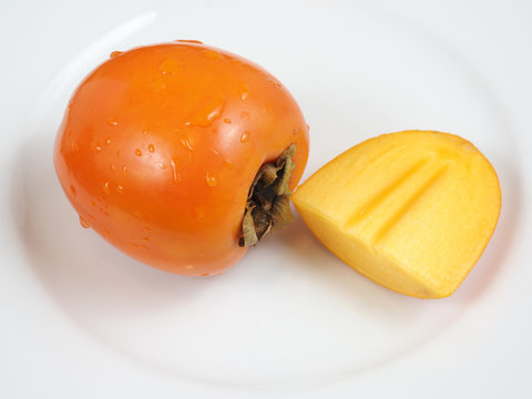 Persimone Teller exotische Frucht ge&ouml;ffnet