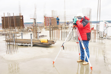 Fototapeta premium Surveyor working with theodolite equipment