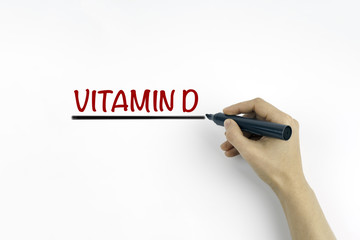 Hand with marker writing Vitamin D