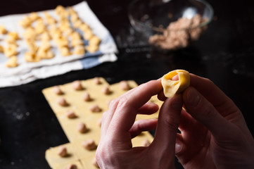 Hand making tortellini