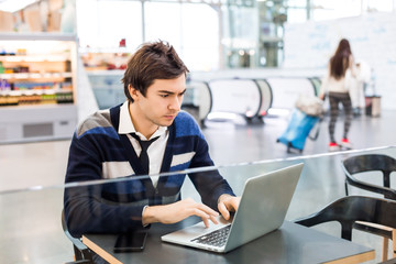 Freelancer concentrated work on laptop