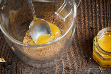 Brown sugar and honey in a tea glass