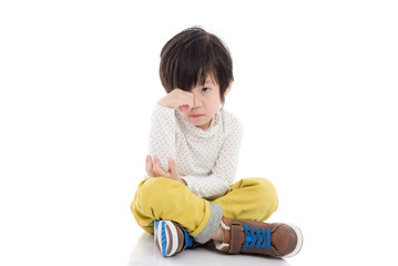 asian child sitting on white background isolated