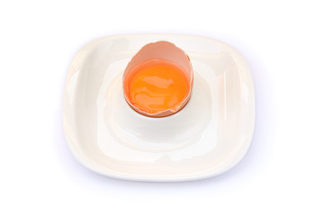 egg yolk in the shell on a plate