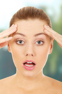 Young shocked woman.