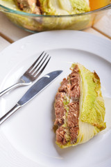 fish baked in leaves of Chinese cabbage with nuts and lemon juic