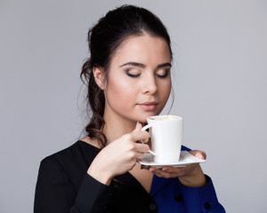 Young brunette woman with a cup
