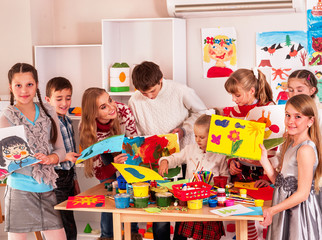 Child painting at art school.