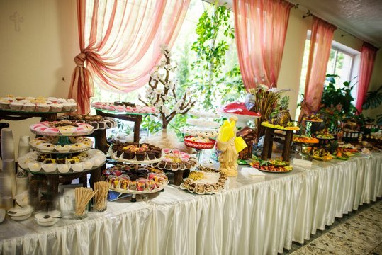 Wedding reception, decor table of fruits and caces