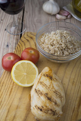 Grilled chicken breast with fresh vegetables .