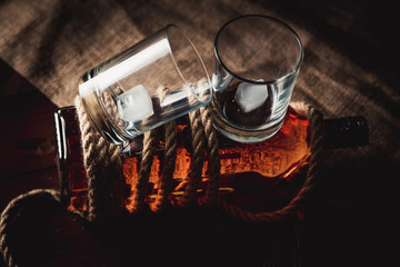 Whiskey stylish photos, brandy and bourbon on the wooden background