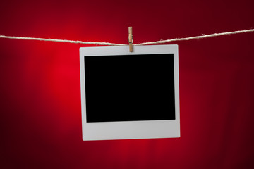 blank photo frame on red background