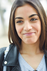 Woman in urban background wearing casual clothes