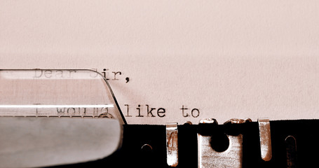 Text Dear Sir typed on old typewriter