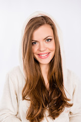 Fototapeta premium Beautiful young girl smiling in dressing-gown