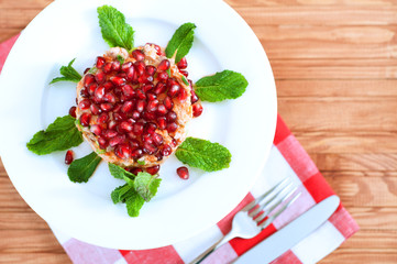 Fresh summer salad with pomegranate, tuna fish, carrots and mint