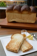 two slide of toast and a loaf of bread
