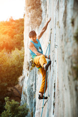 Rock climbing on vertical flat wall - Stock image