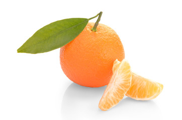  tangerine with slices and leaves on a white background