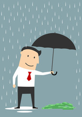 Businessman protecting money with umbrella