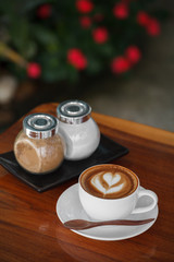 Close-up cup of latte coffee on wooden (Selective focus)