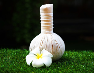 Fototapeta na wymiar Spa massage compress balls with flower, Thailand